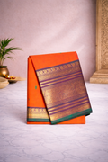Orange with green kanchi boder- hand butta - big border- Chettinad cotton